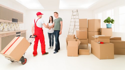 Packed household boxes and furniture ready for mobile storage